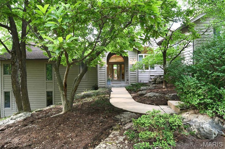 Nestled in a secluded area of Kirkwood, this sprawling 3816 sqft contemporary home with 4 bed/3 1/2 bath,
 that towers over a one acre tree covered retreat. Some of the features include floor to ceiling windows, vaulted ceilings, gleaming hardwood floors, large eat in kitchen with granite countertops, and two gas fireplaces.   A spacious master suite 2-person walk-in closet, expansive bath with dual vanities and a soaking tub. Make your way to the spacious lower level that offers an in-home theatre, bar area complete with sink/refrigerator/microwave-everything for your entertaining needs. This level also includes a second master suite with walk-in closet accompanied with two other bedrooms. The walk out LL opens to a breathtaking outdoor area with a
2-tier pool showcasing a stunning waterfall. This one-of-a-kind outdoor space offers multiple patios, great for entertaining or just relaxing. This luxurious home is nothing short of impressive-prepare to be wowed!