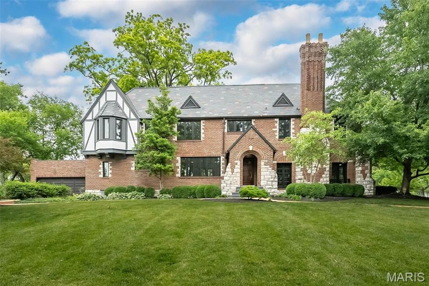 Welcome to this fully rehabbed 1/2 duplex in the desirable Davis Place! It is a stunning example of classic architecture with a modern open concept.  This English Tudor home has all of the classic features expected in a stunning Clayton home. The slate roof, arched brickwork, new Anderson windows and that amazing 3 story brick/limestone chimney.  On the main floor, you'll find an open concept gourmet kitchen with a ~8ft island, quartz countertops with waterfall edge, Kohler fixtures, 2 sinks, and new GE profile appliances. An office adjoins the kitchen with built in bookshelves and could double as a guest bedroom.  French doors lead from the kitchen to the rear covered/uncovered patios. The enormous living room boasts tall ceilings, a large bay window, wood burning fireplace and French doors leading to the front patio. At the top of the stairs is a sitting area perfect to relax with a book.  The large primary bedroom boosts 6 windows, letting in an abundance of natural light, a walk in closet and an updated primary bath with custom shower.  The 2nd bedroom has a small walk in closet and connects to a Jack n Jill bath.  The JnJ bath has custom marble tile, quartz counters with double bowl and lighted mirror will amaze. The large 3rd bedroom has a bay window, original wood floors, French doors that lead to a roof deck, perfect for suntanning. 2nd floor laundry has been added for your convenience. Original oak floors have been refinished! This home won't disappoint. Broker/Owner