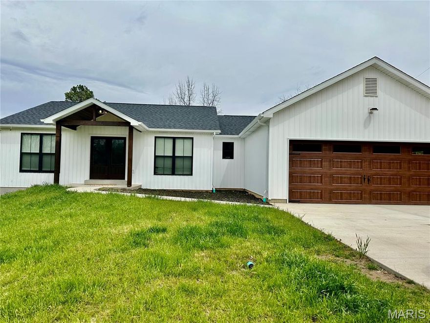 Built in 2023, this well-maintained ranch-style home offers 3 bedrooms and 2 full bathrooms on the main level, with an additional bedroom and full bathroom in the partially finished walkout basement making this a 4 bedroom, 3 bathroom home! 
The open floor plan provides abundant natural light throughout the main living areas. The kitchen features a gas stove and a walk-in pantry, ideal for everyday living and entertaining.
The walkout basement adds valuable living space and flexibility for a variety of uses. Enjoy outdoor living on the covered back deck/porch overlooking the backyard. Additional features include a 2-car attached garage and modern finishes throughout.
Conveniently located next to Walther Park in De Soto, this home offers a great combination of newer construction and functional living space. This is one you wont want to miss! Schedule your showing today!