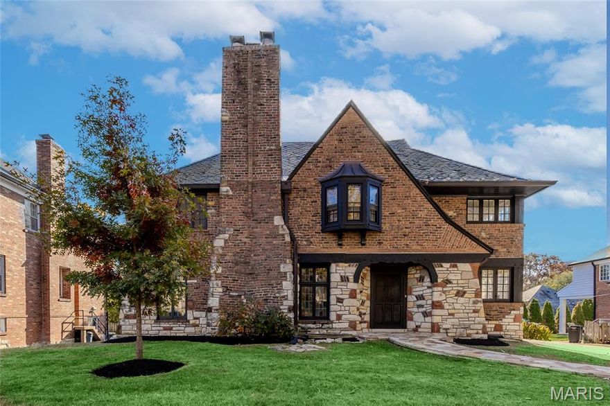 LEAVING MLS THIS WEDNESDAY 12/17 come with best and final offers! Welcome to a Masterfully Renovated Tudor Residence in Prestigious Clayton. Nestled within one of Clayton’s most sought-after enclaves, this distinguished historic Tudor has been meticulously restored to offer timeless elegance and refined living. A testament to superior craftsmanship, every detail of this home reflects pride and precision. The main level unveils a grand sunken living room—both rustic and formal in character—anchored by a magnificent hand-carved wood-burning fireplace and crowned with exposed wood beams. Adjacent, a luminous dining room opens gracefully onto a restored flagstone terrace, seamlessly connecting to the gourmet kitchen. Designed for the discerning chef, this culinary haven features premium KitchenAid appliances, quartz countertops and backsplash, a bespoke range hood, custom cabinetry, and glass-front displays. An additional sunken lounge enhances the home’s entertaining capacity, while a stately main-floor study offers a quiet retreat for work or reflection. Ascend to the second level, where the primary suite awaits—a sanctuary complete with a private dressing area, luxurious bath, and a custom walk-in wardrobe. Three additional bedrooms, two full baths, and a dedicated laundry space complete this floor with thoughtful functionality. The lower level extends the living experience with a warm and inviting recreation room, centered around a second wood-burning fireplace. Whether envisioned as a third lounge, a gentleman’s retreat, billiards room, tasting bar, or home theatre, the possibilities are endless. A finished laundry room and half bath further enhance this level’s convenience. Fresh landscaping, restored stone patio and design-forward modern 2 car carport complete this home.