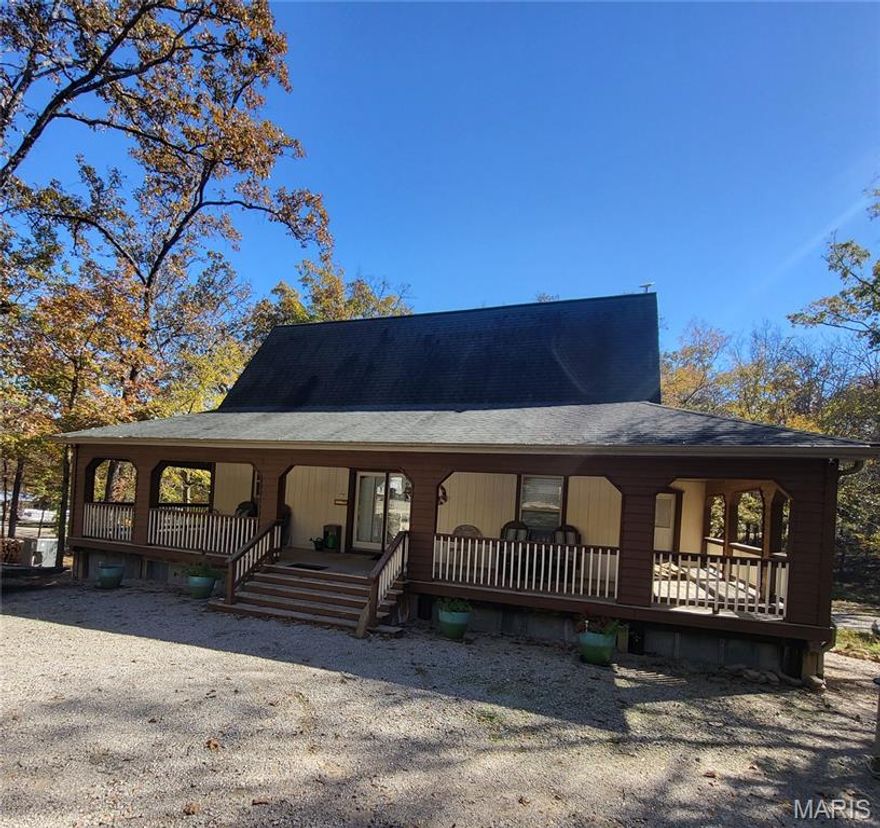 Turnkey investment near Lake Wappapello! This fully leased 39-site RV park includes a rustic lodge-style home, two 1-bedroom rental cabins, and an 8-stall boat storage garage (50'x28'). The RV park generates stable income from year-long leases; tenants pay their own electricity costs. The lodge features vaulted ceilings, a stone fireplace, and a walk-out level clubhouse with a kitchen, coin laundry, lounge, and two full baths. Two bedrooms offer private-porch access and en-suite baths for nightly rentals; a lofted third bedroom adds flexibility. Set in a quiet, wooded neighborhood, the park offers a peaceful atmosphere and a strong sense of community. Whether you're seeking a lake-area retreat, hospitality venture, or multi-use property with reliable revenue, this one blends natural beauty with business potential.