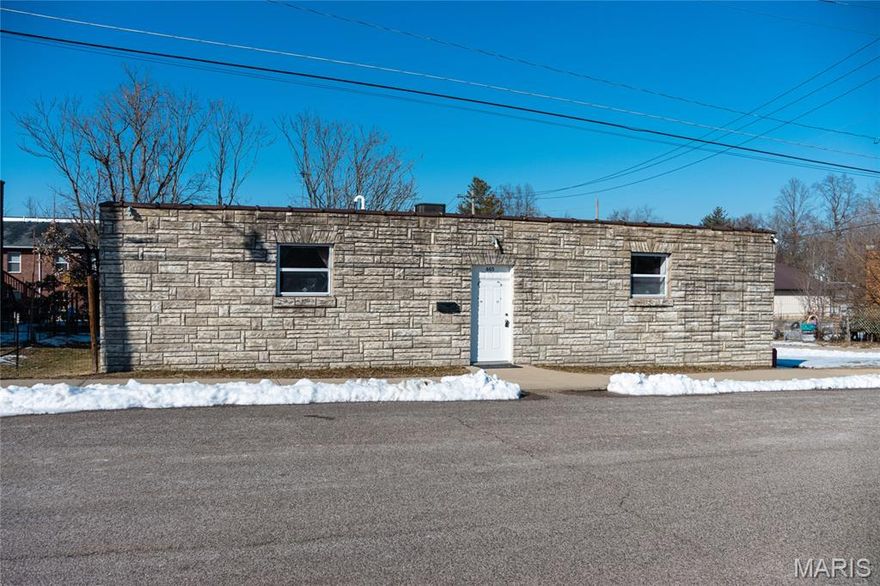 A truly unique opportunity in the heart of Cuba, this one-of-a-kind property offers exceptional versatility and character. Zoned commercial and formerly operated as a dance studio, the building has been thoughtfully converted into a residential home while preserving the open layout and architectural features that make it stand out. Whether you’re seeking a distinctive primary residence, a live/work space, or a property with future commercial potential, this space delivers endless possibilities. The interior is anchored by a massive open living and family room featuring hardwood flooring, providing an ideal setting for entertaining, gatherings, or creative use. The open-concept design allows for flexible furniture arrangements and abundant natural light. The kitchen is well-equipped with stainless steel appliances, a gas range, and ample workspace, making it functional for everyday living or hosting. The primary suite offers a spa-like retreat with a tiled walk-in shower and a separate claw-foot soaking tub, combining charm and comfort. Additional updates include a new roof and HVAC system installed approximately seven years ago, along with a new hot water heater, offering peace of mind for years to come. Outside, the former loading dock has been repurposed into a patio area, creating a unique outdoor space for relaxing or entertaining. Centrally located within the city limits, this property provides convenient access to local shopping, dining, and amenities while standing out as a rare and adaptable offering.