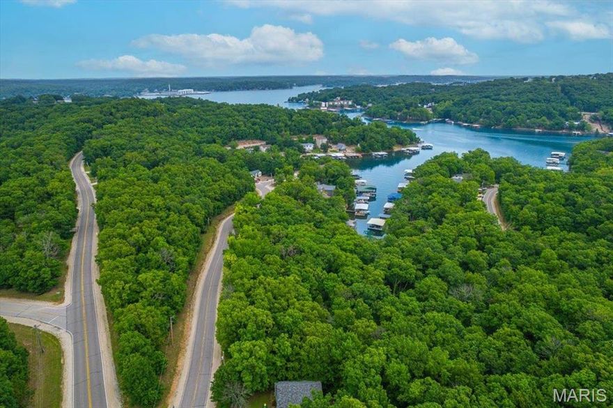 If you're looking to build your next home at the Lake, look no further! 158 Navajo Road is an excellent opportunity located near the Village of Four Seasons. This lot features just shy of a 1/4 acre of land and includes marina access to Downing Branch Cove. Water and sewer utilities are already on site. Bring your plans and builder and take advantage of an inexpensive lot at the Lake of the Ozarks.