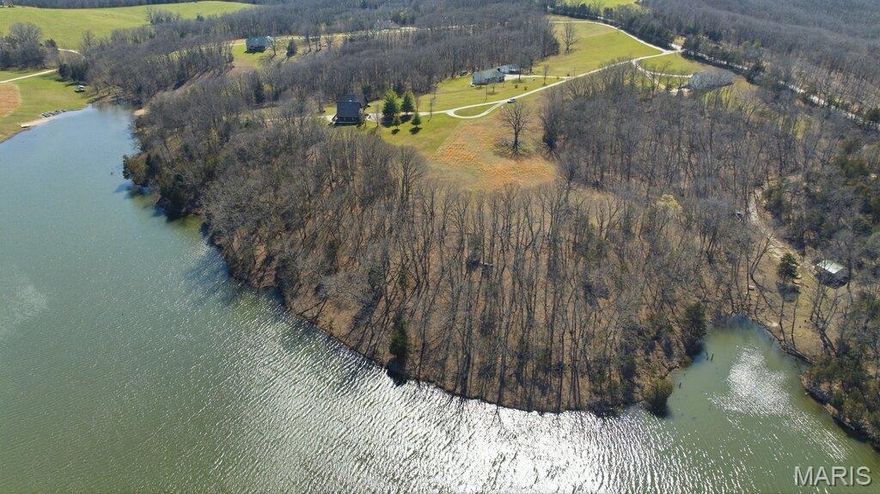 Discover the perfect canvas for your dream haven on this stunning 6-acre lake lot, nestled in a picturesque country setting. Imagine waking up to the gentle sounds of nature, surrounded by mature trees, and glistening water that offer both privacy and a sense of belonging in a quaint community that feels just like home.
Whether you envision building your forever home or a charming weekend getaway, this lot is primed and ready for your unique vision. Take advantage of the serene 22 acre lake right at your doorstep, where you can immerse yourself in the joys of fishing, or simply enjoy peaceful evenings watching the sunset reflect on the water. But sorry, there is No Hunting here.
For families and friends, the property features a delightful park area with a sandy beach, perfect for summer picnics, gatherings, and countless memories. The property is located just outside Rhineland. Which is a short drive from the bustling charm of Hermann, where you can explore local wineries, shop in quaint boutiques, and dine on delicious cuisine.
This 6-acre lake lot is not just a place to build; it's a gateway. Don’t miss your chance to claim this rare gem and start creating the life you’ve always dreamed of. Your forever home awaits!