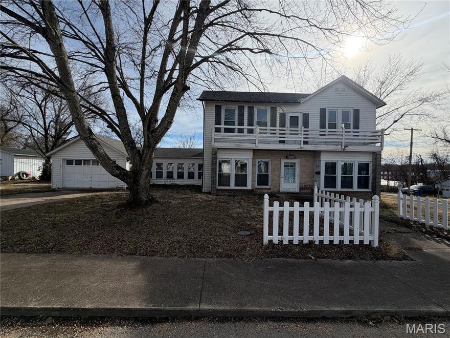 Lovely, historic 2 story home with lots of charm & character, located in Salem, Missouri.. Built in 1900 with an addition in 1950, this home has had some renovations started, offering the perfect opportunity to finish it just the way you envision it!  The large 135' x 180' corner lot has a chain-linked fenced-in back yard.  It is across the street from the serene, 11+ acre Bonebrake Nature Center and just a few blocks to downtown Salem, the county seat of Dent County.  The main floor of the house consists of an open living room & dining room with built-in book shelves. Two of the kitchen walls have been removed for the needed renovation of the kitchen.  There is a 13' x 11'5 room with pine walls that could be a great office.  There is a sitting room with a woodburning fireplace, an utility room & a 14' x 18' glassed-in sunroom that leads to the patio with a built-in BBQ grill. The ornate staircase leads to the 2nd floor with 3 bedrooms, a full bath & a balcony. 9 ft. ceilings are on both levels. Steel/stone exterior. Vinyl tilt-in windows throughout except in the family room. New CA & new natural gas furnace in 2025.  Attached 1 car garage. In 2013, a12' x 26' workshop bldg. w/electric was added in the back yard.  There is a 10' x 14' storage bldg., also in the back yard.  Salem is only 25 miles from the famous Current River, known for its trout fishing & canoeing! Salem is also only 25 from the well-know Missouri University of Science & Technology.  This home is ready for you to make it your own beauty!  View this gem today for just $99,000!