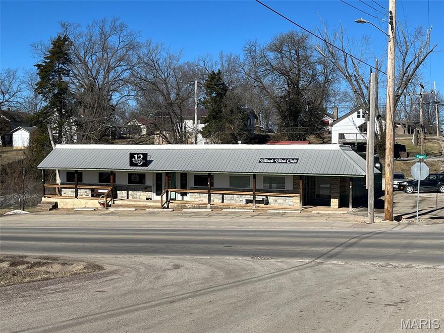 MOTIVATED SELLERS! Here is a great investment property!  The building has had a bunch of updates done; new roof (with 20 year warranty), windows, doors, siding, stonework... The long term renter has taken such good care and has a perfect set up for what they do. The restaurant side has 1.5 bathrooms. There are two more rentals (currently empty) with each having their own half bathrooms for rent. Possiblities are endless!  The tenants pay their own utilities. Looking for a great way to make an investment for your future.... Here you go!! Location: City, Corner, High Traffic!