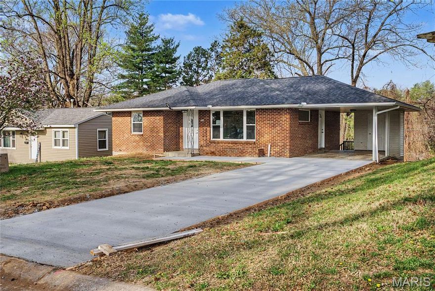 Welcome home to 1635 N Spanish St, a completely remodeled, move-in-ready gem.  This stunning property offers true peace of mind with a brand-new roof, an all-new HVAC system, new windows, and fresh paint and flooring throughout. The beautifully remodeled kitchen is ready for your personal touch, situated just steps from the two spacious upstairs bedrooms and a fully updated bathroom. Head down to the finished basement to find an expansive family room, a dedicated office space, and a large storage area to keep things organized. The lower level also features a private third bedroom, a convenient laundry room, and a second remodeled bathroom showcasing a sleek walk-in shower. Complete with a one-car carport for sheltered parking, this home has been meticulously updated from top to bottom. Don't miss your chance to own this completely turnkey property!