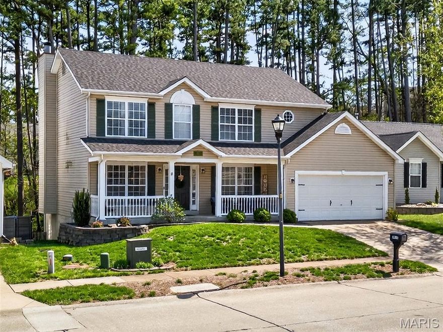 Welcome Home! The only thing more beautiful that the lovely updated and cared for interior of this 2sty home is the gorgeous wooded view from the rear windows and freshly stained deck! Easily maintained exterior, freshly updated landscaping, newer privacy fence in rear yard.. and that is before you step inside! Hardwood floors greet you at the entry foyer and carry through the main level. A warm and inviting interior with neutral paint, great natural lighting and a comfortable flow through the main level with a large family room with gas fireplace that connects to the breakfast room and kitchen. In the chef's kitchen there is plenty of prep space on the large island, SS appliances, new quartz counters and tile backsplash, pantry, plenty of cabinet storage and a great greenhouse window over the sink providing a great view! Two flex rooms at the front of the home are perfect for a formal dining room, home office, playroom, sitting room- there is no lack of space here! A main floor laundry and powder room completes the main level. Upstairs the large master suite offers dual closet space a full bath with sep tub/shower. Three added bedrooms share the hall bath. Head down to the walk out lower level and you'll find a large rec room, a custom wood wet bar with shelving, a 5th sleeping/bedroom and a storage/utility area. A large deck with fresh stain and  patio below and a 2 car garage and a 2 year old roof completes the full package for this great home. The neighborhood pool is just across the street. Don't miss your chance- this home is move in ready and will not last long!