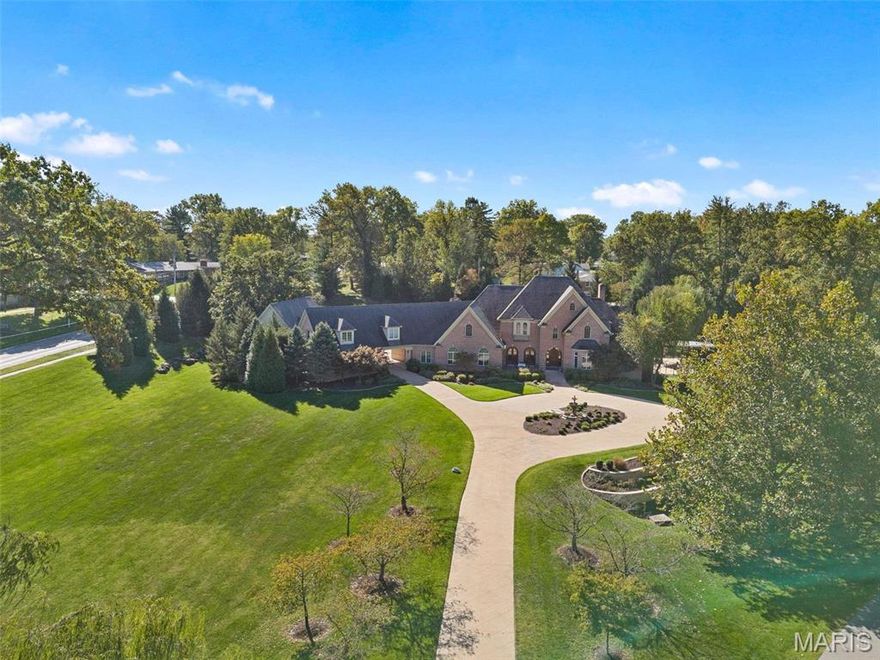 Nestled in the heart of Des Peres within the sought-after Kirkwood School District, this French-inspired estate exudes timeless elegance on an expansive 3.75-acre lot. Meticulously designed for luxury living, the main residence spans over 9,200 sq ft, boasting 8 bedrooms, 6.5 baths, and a captivating blend of exquisite architectural details including a grand double-entry foyer, custom mahogany finishes, and soaring ceilings. Entertain with a gourmet kitchen featuring Viking appliances, granite counters, and multiple living spaces that flow to outdoor terraces with a wood-burning fireplace, in-ground pool, spa, and a sophisticated pool house w/1 Bed & 1 Bath. A separate carriage house w/2 Bed & 2-Bath, ideal for guests or a private retreat, adds an additional layer of grandeur. With an underground tunnel connecting the carriage house to the main residence, a 4-car garage with workshop space, this estate offers unparalleled privacy and sophistication just minutes from St. Louis' best. Additional Rooms: Mud Room