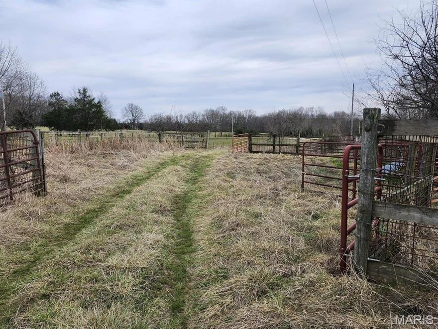 Prime Pasture, Water, & Highway Frontage offering 177 acres m/l. Looking for the perfect mix of pasture, water, and accessibility? This 177-acre m/l tract checks all the boxes. Approximately 140 acres are open and established in grass, making it ideal for cattle, horses, or hay production. The property is well-equipped with multiple water sources, including well with automatic waterers, 2 spring-fed ponds and additional supplemental small seasonal ponds. Everything you need for livestock is already in place with the land being fenced and cross-fenced. There is an old barn (in poor condition) that could be repurposed or removed for a new build site. Extensive highway frontage for easy access and excellent visibility, with NO RESTRICTIONS--giving you the freedom to build, farm, hunt, or invest as you choose. And to top it off--extremely low taxes at only $92/year. Call today to view!