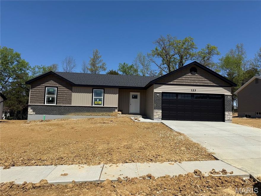 BRAND NEW home with every option you could imagine! They include vaulted ceilings, rounded “bullnose” corners, granite or quartz countertops, stainless steel appliances, 42" cabinets with "cushion close", custom neutral-colored paint job throughout, LVT flooring throughout most of the home, framed windows, taller baseboards, adult-sized cabinets in bathrooms with marble countertops, walk-in closets, upgraded carriage garage doors with openers on 2 CAR Garage, full bath rough-in, panel doors (many varieties), and upgraded water/light fixtures throughout the house! MAIN FLOOR laundry! Fully sodded yard (front/sides/back). *Pictures are of previously built homes. Builder/Broker* This home is USDA eligible.