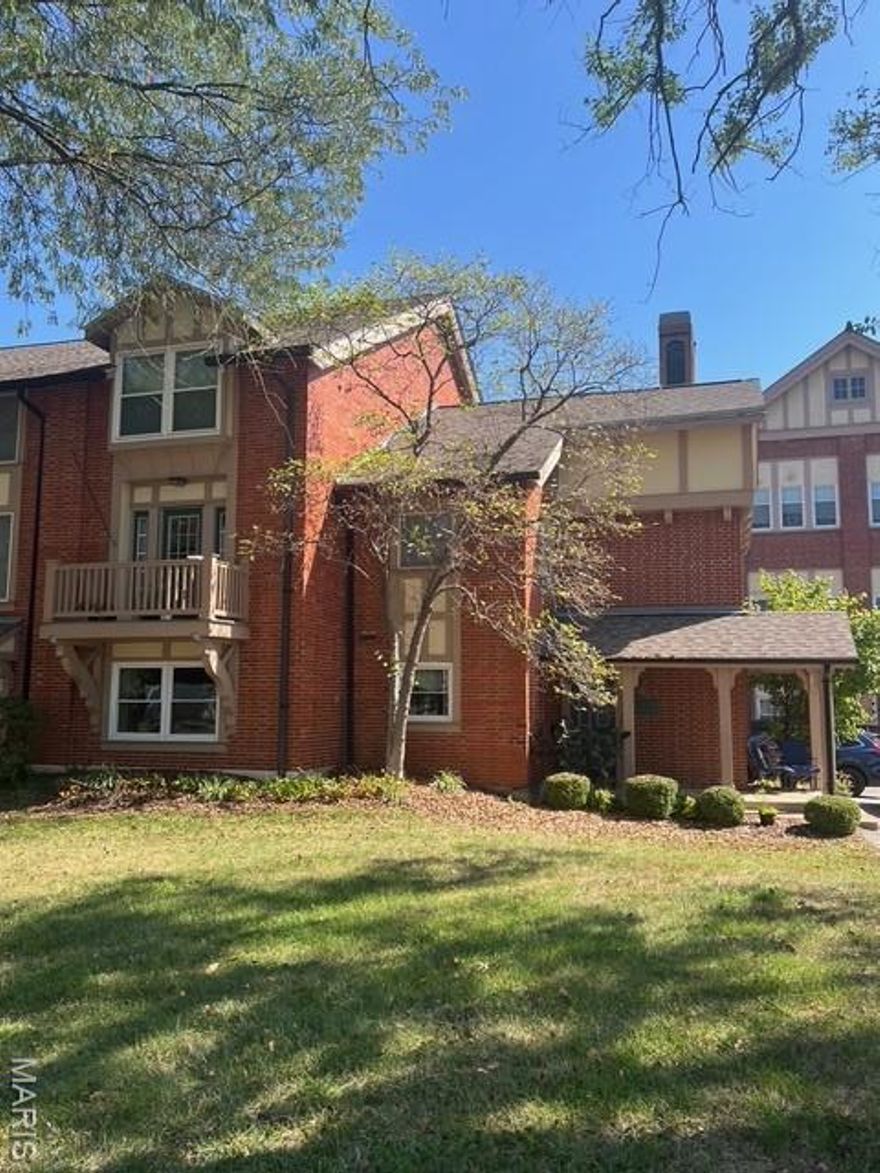 A Spacious 2 level condo in the newer section of the Historic, Goodall Manor Condo's. A short walk to Webster's community Rec Center complete with swimming pool. Easy access to I-44. Flexible floorplan. The main level features Laminate wood floors, a stylish foyer, spacious living & dining rooms with crown molding, a lovely balcony & a third bedroom currently used as family room/ Study with a dry bar & beautiful antique oak fireplace mantle. The updated kitchen features a unique mosaic ceramic tile floor & stainless appliances. There's a main floor laundry (with bonus separate shower) & half bath.. Upstairs, the large loft is currently used as a play room, perfect for home office or as additional sleeping space, featuring built-in shelving & vaulted ceiling. The primary bedroom includes window seat & walk-in closet with built in shelving, full bath with shower and updated vanity. The second upper level full bath in the hall, services the 2nd bedroom and condo at large  There is a two-car detached garage, offering additional storage space. This is a truly an exceptional condo within strolling distance to one of the best equipped municipal recreation facility in St Louis County!