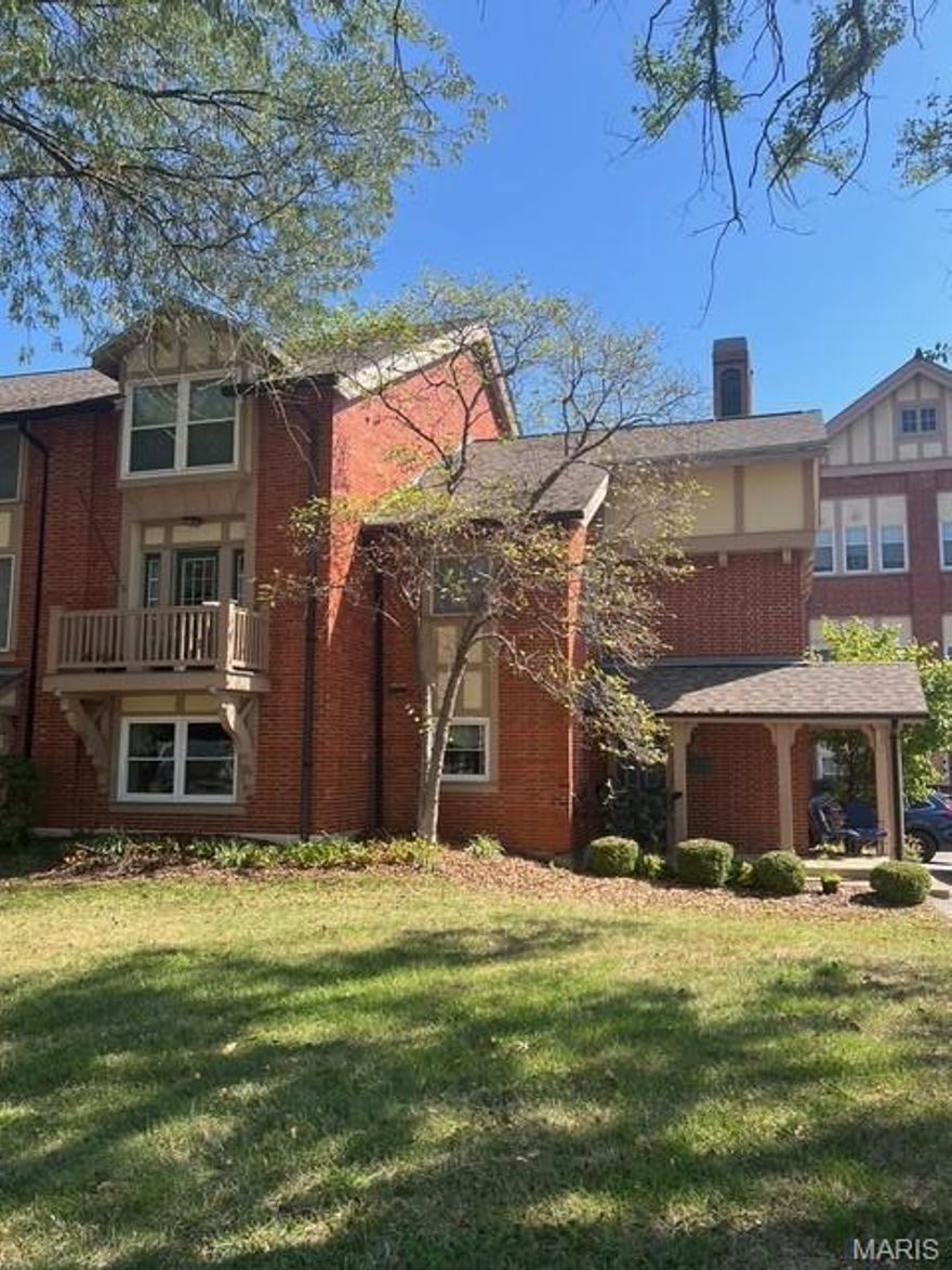A Spacious 2 level condo in the newer section of the Historic, Goodall Manor Condo's. A short walk to Webster's community Rec Center complete with swimming pool. Easy access to I-44. Flexible floorplan. The main level features Laminate wood floors, a stylish foyer, spacious living & dining rooms with crown molding, a lovely balcony & a third bedroom currently used as family room/ Study with a dry bar & beautiful antique oak fireplace mantle. The updated kitchen features a unique mosaic ceramic tile floor & stainless appliances, refrigerator has been recently replaced. There's a main floor laundry (with bonus separate shower) & half bath.. Upstairs, the large loft is currently used as a play room, perfect for home office or as additional sleeping space, featuring built-in shelving & vaulted ceiling. The primary bedroom includes window seat & walk-in closet with built in shelving, full bath with shower and updated vanity. The second upper level full bath in the hall, services the 2nd bedroom and condo at large  There is a two-car detached garage, offering additional storage space. This is a truly an exceptional condo within strolling distance to one of the best equipped municipal recreation facility in St Louis County!