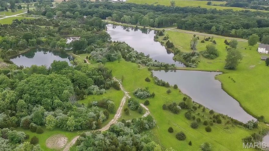 Huge Price Reduction! Seller is motivated and ready for a quick close! LOCATION, LAND and PRIME WATERFRONT PROPERTY on this exceptional 35+ acre parcel just minutes from I-70 and near the Warrenton Golf Course. This rare offering is fully subdivided into eight 3+ acre homesites, with six lots featuring private lake frontage across multiple scenic lakes. Water and electric are in place at the entrance off Hwy 47, Owl Creek, and Quarry Rd, providing a convenient setup for immediate connection whether building a private residence or developing the property. Fiber is nearby for connection. A development proposal has been approved by the city/county, providing a streamlined opportunity for builders or developers. Two approach roads are already in place, including direct access from Hwy 47 and Quarry Rd. This property also presents a unique opportunity for an individual looking to build a private estate or weekend retreat surrounded by water and natural beauty. Not part of the Owl Creek subdivision and no HOA restrictions. A rare chance to secure a large waterfront property with development potential in a highly desirable location.