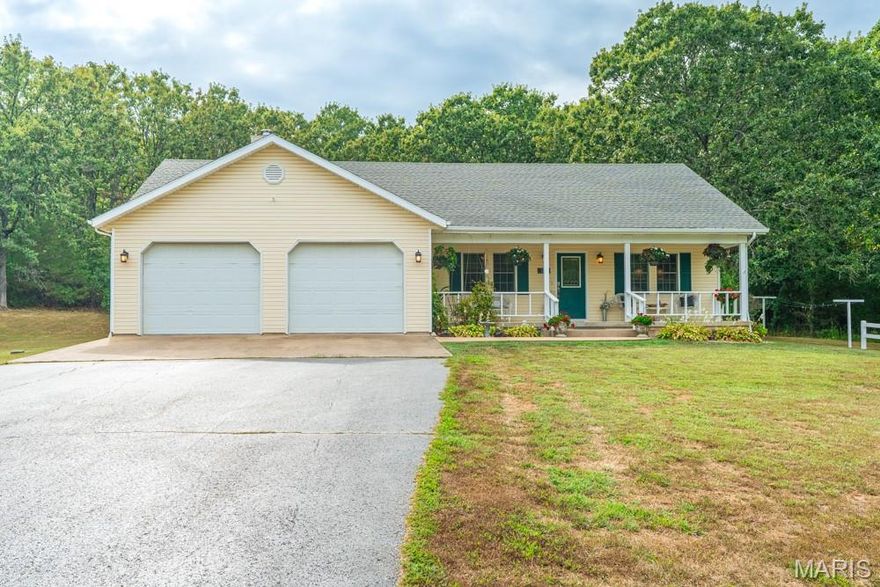 Looking for a little slice of country charm without giving up space and comfort? This three-bedroom, two-bath home is ready to deliver just that! Nestled at the end of a curving paved driveway that winds through the trees, you’ll have plenty of room to stretch your legs, plant a garden, or maybe even try your hand at raising chickens (the coop is up to you) on the nearly 5 acre lot. With 2135 square feet of living space, this home gives you all the elbow room you need—inside and out. Step inside and you’ll find a roomy open concept living room for everyday lounging and dining room for hosting family and friends, a family room with fireplace for game nights, a large kitchen that can handle all the cooking chaos, and a coxy breakfast nook overlooking the backyard. Hardwood floors and carpeting add warmth and character throughout. The spacious primary suite features a jetted tub/shower, and the 2 guest rooms and full bath are amply sized as well. The covered front porch is perfect for morning coffee or a rocking chair nap. But wait, there’s more—you’ll absolutely love the detached two-car workshop with three-phase electric. Whether you’re a hobbyist, tinkerer, or someone with serious tools, this space will make your heart skip a beat.  If you’ve been dreaming of country living, a beautiful home with plenty of character, and a workshop that could inspire your next big project, this is the one you’ve been waiting for. All that’s missing is you - so CALL TODAY BEFORE IT'S GONE!