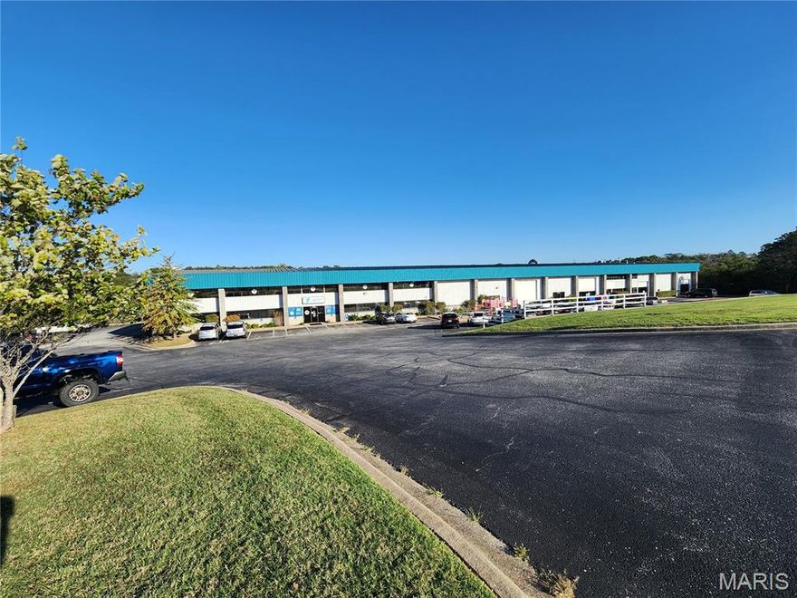 PURE POSSIBILITY!!  35,000 sq. ft. light manufacturing and office building situated on 10.97 acres at the end of Industrial Park Drive in Hollister, MO. Zoned I-1 Industrial, this steel-frame flex facility is designed for up to 7 tenants and features both warehouse and office space. Includes an upper mezzanine with office and storage areas, 4 drive-in overhead doors (two 12'x12', two 16'x16'), and 7 dock-high doors (10'x8') for efficient loading and access. Currently, the YMCA occupies 22,500 sq. ft., and an additional tenant occupies 12,500 sq. ft. This excellent location is ideal for investment or owner use in Hollister's established industrial park