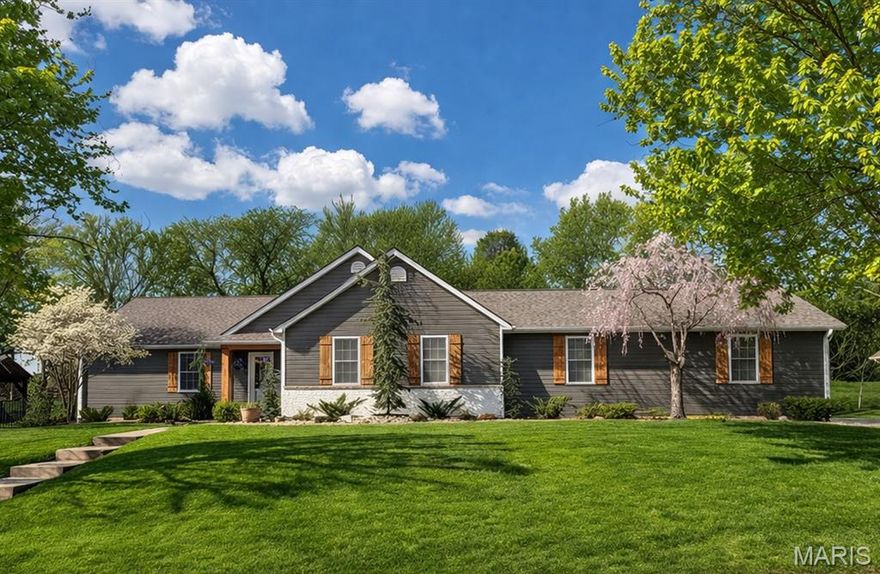 Gorgeous home located in desirable Cottleville, in the community of Windsor Place.  Spectacular ranch home featuring 4 bedrooms, 2-½ bath, oversized rear-entry 3-car garage.  SPACIOUS open floor plan; great room with vaulted ceilings, gas fireplace and sophisticated hand scraped hardwood flooring, beautiful custom color paint.  The chef in the home will enjoy every minute cooking and entertaining in the updated remodeled DREAM kitchen with quartz countertops, soft-close custom 39” shaker-style cabinets w/dish dividers & under cabinet lighting, herringbone subway backsplash, center island w/ breakfast bar, custom paneled Sub-Zero Refrigerator, WOLF Double Oven and gas cooktop, custom paneled Cove dishwasher, microwave drawer & lots of recessed lighting. The kitchen offers a pantry plus a party or craft storage closet.  Desirable divided bedroom floor plan, primary suite with tub & separate shower,  double-sink vanity plus and dual closets.  The additional three bedrooms & full bath located on opposite side of the house. Updated main level laundry. Upscale farmhouse 1/2 bath just recently updated.  Soaring ceilings, bay window, custom wood wall treatments.  Iron railing leads you to the large open lower level featuring can lights, 2 large finished storage closets, dual electric boxes, bathroom rough in, sump pit and pump.  Fantastic private yard, patio, pergola ~ large .63 acre fenced lot.  Abundant new landscaping, beautiful feature trees and plants, upscale curb style landscape edging.  3 car oversized garage with work bench, built in storage and a clean up sink, plus - room to store your golf cart.  Cottleville is an approved golf cart community - start enjoying everything Cottleville has to offer. Just a minute from down town Cottleville, dining, shopping and entertainment PLUS a wonderful park, swings & park equipment, amphitheater, volleyball courts, dog park and pavilions. Seller's list of the updates that they have done: new landscaping surrounding the entire house and backyard, 20+ new specialty trees, rock in all landscape areas plants, shrubbery, and grass improvements, cedar shutters, posts, and front porch ceiling at entryway. Freshly stained wood fence.  New concrete driveway pad by garage (38' x 30') 2025, backyard pavilion with ~17x17 concrete pad 2023, Includes fan and in-ground electricity connected to the house.  Roof replaced with 30-year warranty - March 2026. Updated kitchen - new gas burners on interior Wolf stovetop (2025). Most of the appliances have apx 1 year warranty remaining.  New HVAC system 2024 (includes smart interior controls) Freshly painted interior walls and baseboards (2026), Freshly painted front door.  Updated lighting fixtures and ceiling fans throughout the home. Custom wood board and batten wall accents 2024 in Primary entryways and Secondary full bathroom. Remodeled powder bath 2025 added shiplap, trim, cedar, and wallpaper.  New shower heads in both bathrooms, Remodeled vanity in secondary full bathroom 2024. Remodeled fireplace with paint and brand-added custom solid cedar mantle 2025, New Fireplace Ignition system 2024. Laundry room mantle shelf added and painted cabinets (2025), New closet storage systems (2025) New live edge wood shelving in secondary bedrooms 2025. Added 8 new recessed (canned) lights in living room 2024, 2 new electrical switches with dimmable features 2024, 12 recessed lights and switches in basement 2025. New white concrete paint in basement 2025. New baseboards in basement 2025. Remodeled exterior brick on house, Remodeled exterior brick on mailbox.  Added Smart locks and Ring cameras.  This home offers so much plus a subdivision that offers a beautiful entry with 2 small lakes/ponds with quiet relaxing sitting area.  Walk paths plus Cottleville offers golf cart paths.  Fantastic HOME & LOCATION.