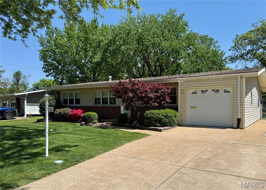 Welcome home to 1330 Spring Valley Drive, a beautifully maintained and thoughtfully updated residence nestled in the heart of desirable Florissant. From the moment you arrive, you’ll appreciate the inviting curb appeal and the clear pride of ownership that carries throughout the home.  Step inside to discover gleaming hardwood floors flowing across most of the main level, creating a warm and cohesive atmosphere. The updated eat-in kitchen offers ample space for both everyday meals and gatherings, featuring a large garden window, durable vinyl flooring, and a functional layout that keeps you connected to the rest of the home. Just off the dining area, a sun-filled family room addition provides extra living space and opens directly to a low-maintenance composite deck, perfect for relaxing or entertaining while overlooking the fully fenced backyard.  This three-bedroom home offers the convenience of two fully updated bathrooms on the main level, including a private ensuite in the primary bedroom complete with a walk-in shower. The finished lower level further expands your living options, featuring a comfortable rec room and a versatile bonus room ideal for a sleeping area, home office, or hobby space.
Additional highlights include a one-car garage with opener, a two-car driveway, a large backyard storage shed, and an in-ground irrigation system covering both the front and back yards, making lawn care a breeze. Major updates include a newer roof, windows, electrical panel, and water heater. With its thoughtful improvements, excellent maintenance, and true move-in-ready appeal, this home is ready for its next owner to enjoy.