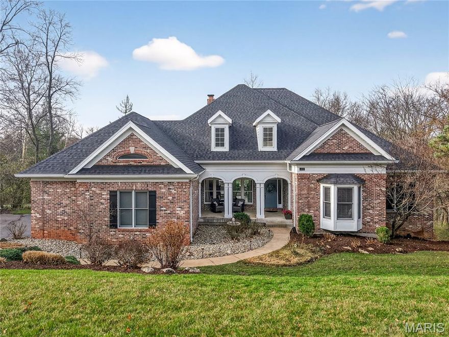 **Showings start Thursday, March 19*** 
Enjoy lake privileges and close proximity to golf, dining, and recreation at Lake Forest Country Club in this beautifully designed 5-bedroom, 6-bath (4 full, 2 half) ranch home. Thoughtfully updated and impeccably maintained, the home features a brand-new roof and gutters for added peace of mind.
The main level welcomes you with a formal dining room that opens into a stunning living room highlighted by a dramatic 15-foot coffered ceiling and a fireplace that seamlessly connects to the adjacent kitchen. Rich hardwood flooring flows throughout the kitchen, living room, dining room, and hallway, creating warmth and continuity.
Designed for both everyday living and entertaining, the chef’s kitchen is equipped with premium Sub-Zero and Wolf appliances, including a built-in refrigerator, 36” induction cooktop with downdraft, 30” double convection ovens, built-in microwave, and dishwasher, along with a 24” Elica wine and beverage center. Custom cabinetry is beautifully complemented by Cambria quartz countertops, while the island features a striking raised walnut top. Just off the kitchen, a casual TV room with vaulted ceilings and walls of windows fills the space with natural light.
Step outside to the two-level composite deck, newly built in 2022, and enjoy the peaceful, tree-lined setting—your own private outdoor retreat.
The main floor offers four bedrooms on a separate wing, all with newer carpeting. One bedroom includes a private en-suite with accessibility features such as a low-curb shower, corner bench, grab bars, and handheld showerhead—ideal for guests or multi-generational living. Two additional bedrooms share a stylish Jack-and-Jill bath. The expansive primary suite features a sitting area and a fully remodeled spa-like bathroom with dual sinks, a walk-in shower, and a freestanding soaking tub.
The finished lower level is designed for entertaining, complete with a pool table area (pool table included), bar, family room, fifth bedroom, and a full bath. A bonus finished room—perfect for a home office or guest space—adds flexibility, while generous unfinished storage areas meet all your needs.
Move-in ready and offering refined comfort, this exceptional home is ideally located in one of Lake St. Louis’ most desirable communities.