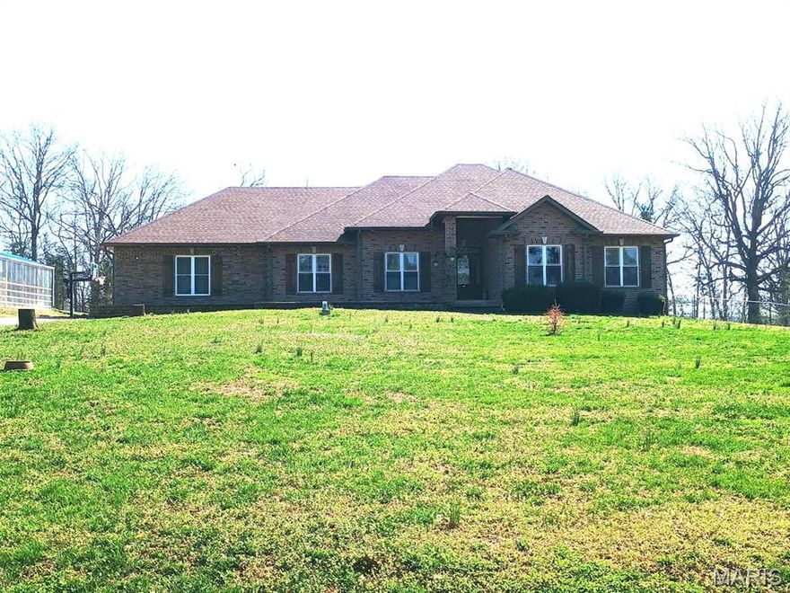 VIP 4981  
JUST REDUCED!!!  TWO HOMES !!!!  Custom Built Country Home boasts 5 Bedroom 3.5 Bath Brick home with custom mill work throughout the home, 2 car attached garage with additional garage for mowers, etc. and storage in garage.  Additional 2 Bed 2 Bath,  2024  (16 X 60) Manufactured Home with chain link fence in it's back yard, on property that can be divided off from this property & has own address and property ID as well, being used currently as a BB for additional income. 
Main home Kitchen has lots of Custom Cabinetry , beautiful Center Island, Wine Cooler, Microwave and so many additional touches! Separate Dining area with wood flooring, Living Room with 11 foot ceilings and a view of the Patio leading out to the In Ground Pool with a slide. BONUS is a 16 x 60 Green House with an outside Wood Furnace that can heat the Main Home and water. Main home has a Lenox Heat Pump with electric backup.  Workshop has a gravel floor. Utility shed also on property.