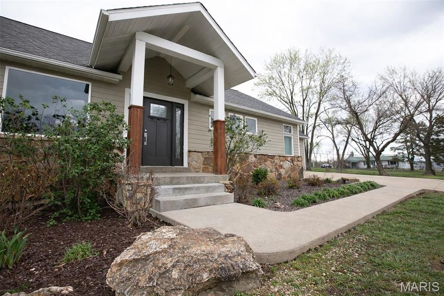 Custom-built modern farmhouse on 1/2 acre m/l offering exceptional design, upscale finishes, and low-maintenance living. Built in 2015 and remodeled in 2026, this 3-bedroom, 2-bathroom home features vaulted ceilings, luxury vinyl and ceramic tile flooring throughout, high-end curb appeal & landscaping, and a beautifully designed open layout. The stunning kitchen showcases custom black and white cabinetry, a large center island with farmhouse sink, and an impressive custom walk-in butler pantry. Exterior highlights include professional landscaping, privacy fencing, and a FULLY hardscaped backyard designed for effortless outdoor living. Enjoy the covered, screened-in patio with TV hookup year-round. Full unfinished basement offers additional potential with rough in bathroom. A truly standout property with custom detail that you don't want to miss.