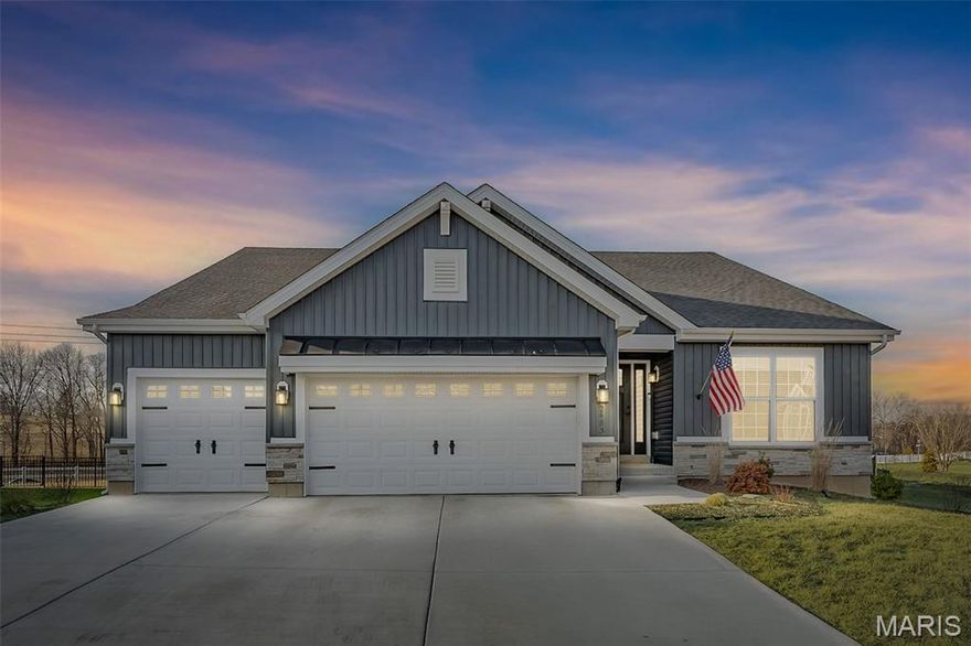 This stunning 1.5 year old, 3 bedroom, 2 bathroom craftsman-style ranch sits on a cul-de-sac lot nearly a 1/4 of an acre, offering Jefferson County taxes in the highly desirable Rockwood School District. The home showcases beautiful curb appeal and a thoughtfully designed, open interior filled with natural light.
The expansive great room features vaulted ceilings, recessed lighting, and a sleek gas linear fireplace with mantel and remote, creating a warm yet modern focal point. The open layout flows seamlessly into the designer kitchen, complete with white quartz countertops, a large center island, two-tone cabinetry, pantry, and stylish pendant lighting—perfect for entertaining and everyday living.
The dining area opens to a composite deck with stairs and a large concrete patio. The large and flat backyard is completely enclosed with black aluminum fencing and 3 gates.
The spacious primary suite serves as a private retreat with coffered ceilings, a bay window, and a spa-like bath featuring a jacuzzi tub, dual vanities, LVP flooring and a large walk-in closet. Additional highlights include black iron spindles, an alarm system, and a three-car garage with Wi-Fi-enabled doors.
The 9-foot pour basement includes a bath rough-in and egress window, offering outstanding potential for future finished living space.
Residents enjoy exceptional neighborhood amenities including a lake with fountain, pickleball courts, and a community barn available for private events. A rare opportunity for one-level living with upscale finishes, generous outdoor space, and an unbeatable Eureka location.