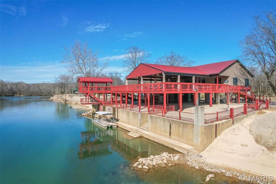 This is one of the best cabins on Current River AND one of the nicest private beaches! Almost four acres of riverfront property covering three lots. Home was built in 2019 above the 2017 flood line! As amazing on the inside as the outside. 4 bedrooms, 2 1/2 baths, with large living room, and stainless appliances. FULLY FURNISHED, this is an absolute showplace! Outside, you will find one of the most elaborate entertaining setups in this area. Two levels for the family and friends to enjoy including a covered deck with composite decking. There's an extended covered deck that goes out over the beach. The pontoon boat and hot tub stay! The next two lots up river with great sand beaches are all part of the property. Room for privacy or rental income potential with 8 RV hookups ready to go. Professionally built seawall with plenty of steel posts, stem walls, and concrete to protect the property from the effects of the river. Also includes a NEW PRIVATE BOAT RAMP! Too much to mention here.