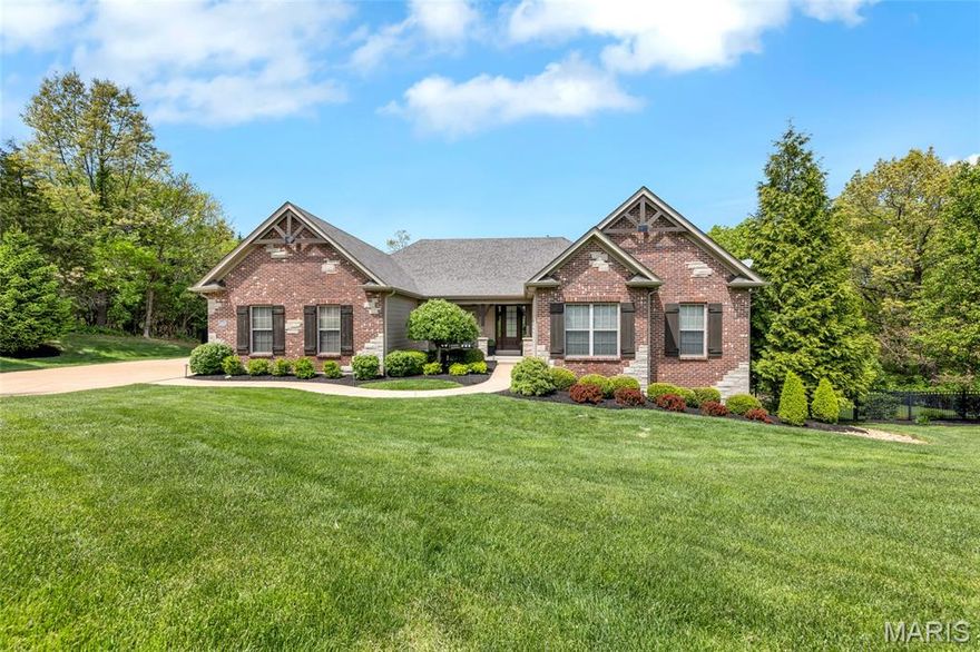 Welcome to 1707 Shepard Road. Experience refined living in this stunning Fischer & Fritchel 4 bedroom, 3.5 bath ranch nestled on 3.09 private acres with 4,000 sq. ft. of beautifully finished living space. From the moment you arrive, the stately curb appeal sets the tone for the thoughtful design within. The foyer features rich hardwoods that expand throughout the home and opens to a formal dining room distinguished by wood beamed columns, while the expansive great room boasts custom entertainment center and built-in speakers and abundant natural light flowing through the vast window wall. The open concept chef’s kitchen impresses with a generous center island, stainless steel appliances, double wall ovens, stone counters, high end cabinetry and a walk in pantry, seamlessly connecting to the breakfast room with deck access, and a warm hearth room anchored by a stone gas fireplace. The primary suite is a luxe retreat with spacious, dual walk in closets, double vanities and a substantial, spa like tiled shower. Two additional bedrooms serviced by a full bath, large mudroom with laundry and a powder room complete the main level. The walk out lower level is ideal for entertaining and features a large family room, a full wet bar, as well as a guest bedroom with walk in closet, full bath, home gym area and ample unfinished space for storage or additional expansion. Enjoy the secluded, tree lined backyard while relaxing on the platform deck or lower patio area. An oversized, side entry 3 car garage, pristine landscaping, partially fenced yard and lawn irrigation completes this exceptional home. With upscale finishes throughout and every detail carefully considered, this meticulous residence offers comfort, luxury and location. Fabulous opportunity within the award winning Rockwood School District.