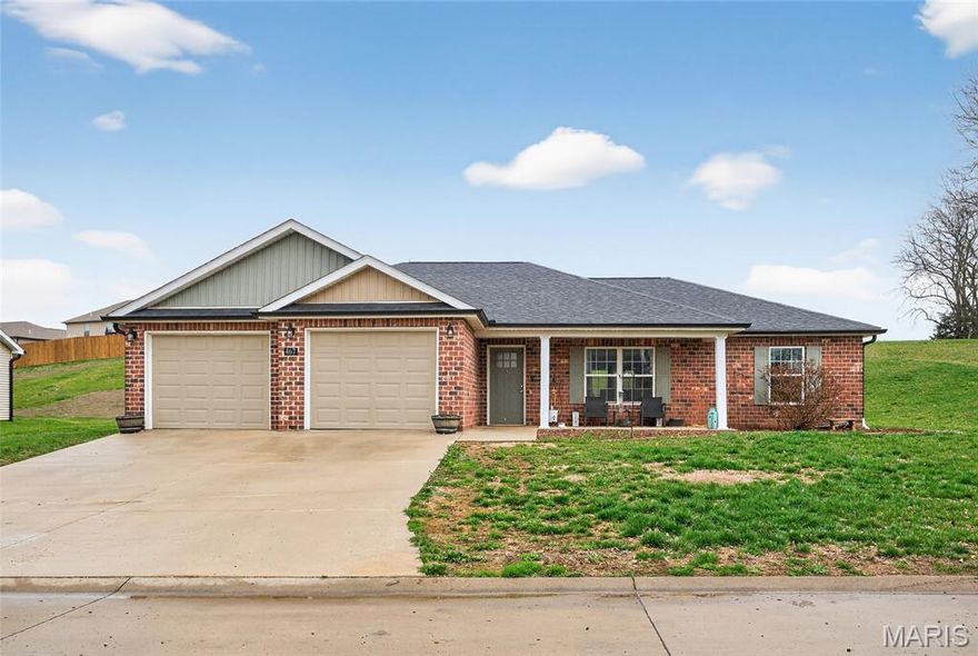Think Oversized and Storage! This home was thoughtfully designed with an open floor plan, oversized garage and closets galore! The kitchen has style and function featuring soft close cabinets, subway backsplash, island with seating.  Outside enjoy the front porch or covered patio.