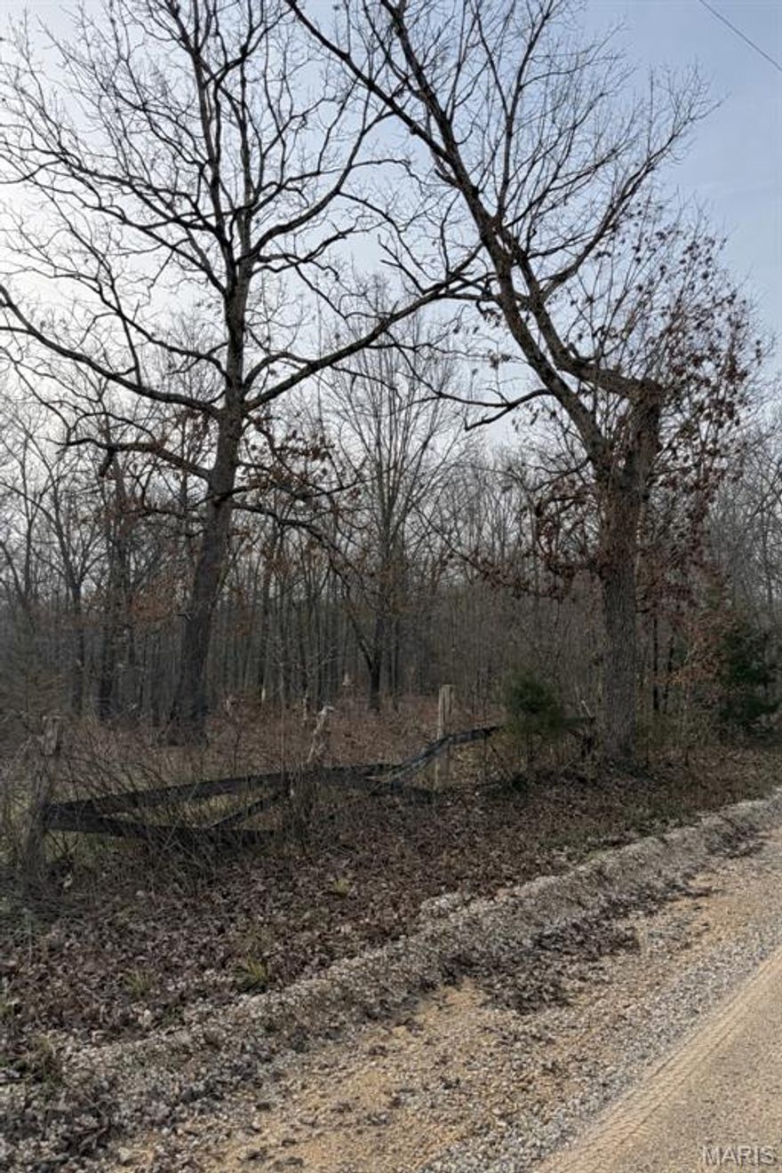 Fenced, convenient road frontage, plenty of woods. Use for building, recreation or animals.  Electric available, small shed, and close to USA forestry/government land.  Lots of possibilities!