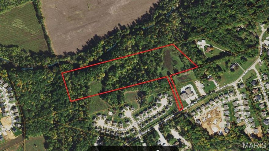 Private wooded 17.81 Acres of Peine Road in Wentzville! Would make a great subdivision or a private estate! The future David Hoekel Parkway Arterial is proposed to run adjacent to this property making it a great investment for future commercial endeavors.  There is currently an approved final development plans for McCoy Creek Estates a 55+ senior villa community offering 24 villa buildings 48 total units and a community clubhouse that will expire 2/12/2027. A builder or developer could move forward with McCoy Creek Estates or have several options for a new medium density residential development or several gorgeous private home sites overlooking McCoy Creek valley. Call to set up private showings with listing agent.