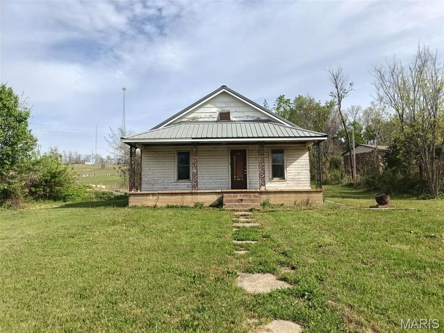Looking for a project or great investment opportunity? Check out this home that has been completely gutted and is a clean slate for a complete remodel. It is down to the studs on the interior with no insulation, no electrical or plumbing fixtures. It is framed out to be a 3 bedroom and 1 bath. It does have a newer metal roof and soffits. This home sits on 1.1 acres in town with city water and city sewer. The property has been cleared and cleaned up. Lots of possibilities. Motivated seller. Property being sold as is.