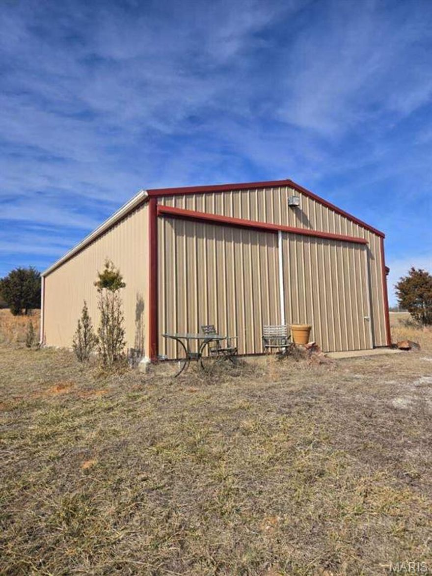 Check this out!! 5 acres m/l of gently rolling land featuring a 24x40 shop with electric, concrete floors, and a large front sliding door. Shop has no water or sewer. Property includes two ponds, a carport, partial fencing, and a gated entrance. Plenty of room for equipment, livestock, or a weekend retreat.