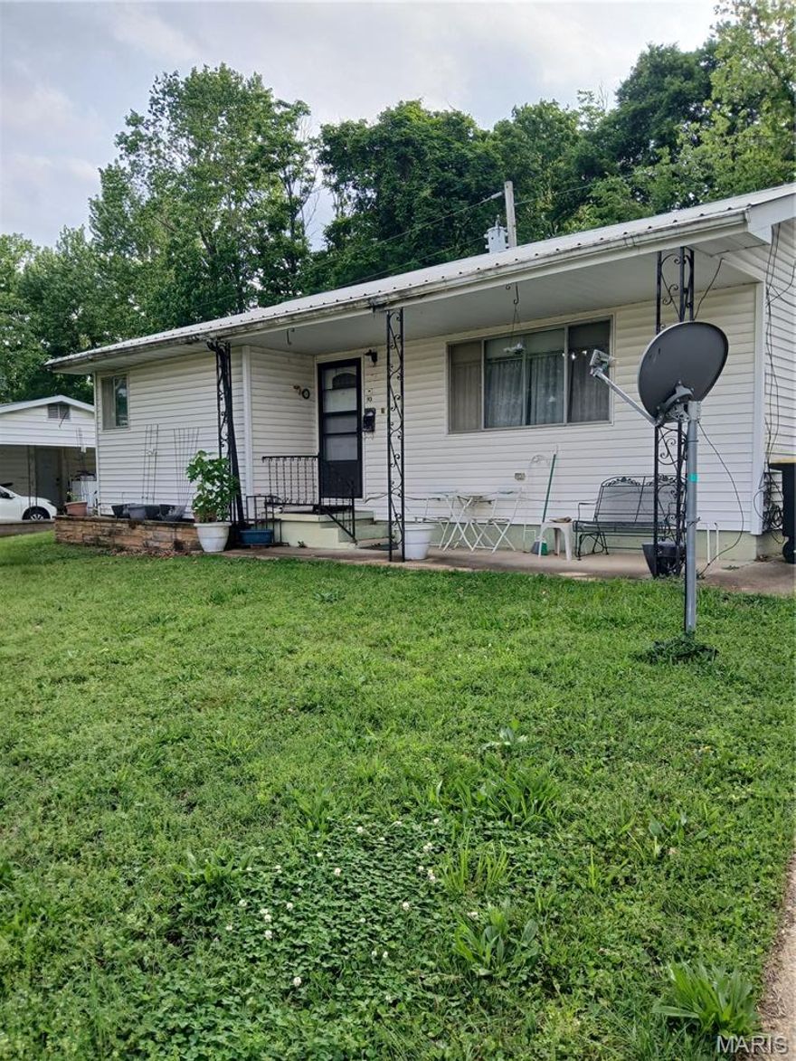 Looking for a great starter home in a quiet neighborhood? This 2, could be 3, bedroom home offers ample living space at an affordable price. This home has nice size bedrooms with a walk in closet in one room that could be considered the primary bedroom. The living room is oversized for a home this size. In the 2 car garage, you will find 2 storage/work rooms, one that is cooled with a window A/C. The eat-in kitchen has space for a dining table and chairs as well as a corner lazy-Susan cabinet for easy access. The appliances all stay! The kitchen has a cookstove, refrigerator and dishwasher. The newer washer and dryer will stay as well! With the metal roof, there will be no worries of needing replaced soon! With a little TLC, this could be a very nice home for you or your family. Great curb appeal with the concrete drive and beautiful front yard! All priced to sell at $99,900. Livable homes are almost impossible to find in this price range! Call Today!