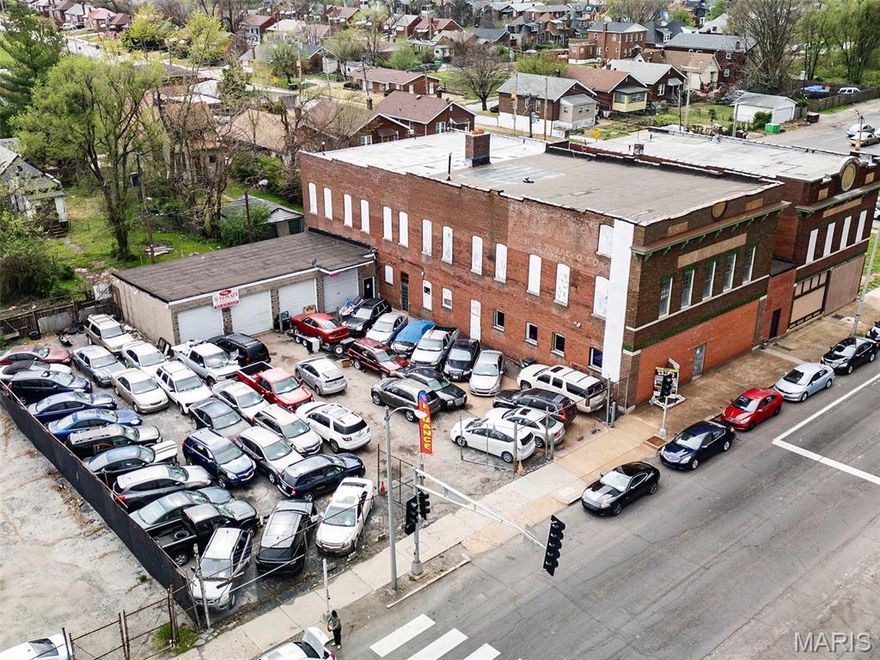 WOW! Massive commercial property currently bringing in $25,000/year. Value add opportunity. 22,000 square feet. DOUBLE signalized intersections. Heavy traffic and advertising opportunities. ~250 feet of frontage along Natural Bridge. Former Moose lodge with open space commercial, potential event venue, daycare, auto lot/auto storage. 4 drive-in garage bays. Rear alley exit with fenced yard. Potential redevelopment.