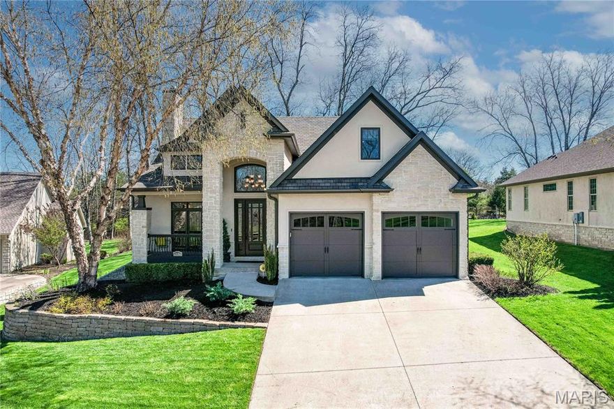 Experience refined living in this beautifully appointed 1.5-story luxury home nestled against a serene wooded backdrop. Designed with elegance and functionality in mind, the home features warm, inviting color palettes, a grand staircase making a striking first impression, and an upscale trim package complete with custom built-ins. Plumbing is in place for convenient main-level laundry. The spacious layout includes a full walkout basement that opens to a private patio--perfect for relaxing or entertaining while enjoying the peaceful surroundings. Located just moments from the clubhouse and golf course, this home has exceptional lifestyle benefits with owner discounts to The Club at Old Hawthorne. The Club offers access to an 18-hole championship golf course, resort-style pool, tennis courts, and a vibrant calendar of social activities--all contributing to one of Columbia's most sought-after communities. Thoughtful updates enhance both comfort and peace of mind, including a Culligan water softener with whole-house filtration system, reverse osmosis system, newer roof, radon mitigation system, and a new HVAC system. This exceptional property combines luxury, convenience, and community in one remarkable offering.