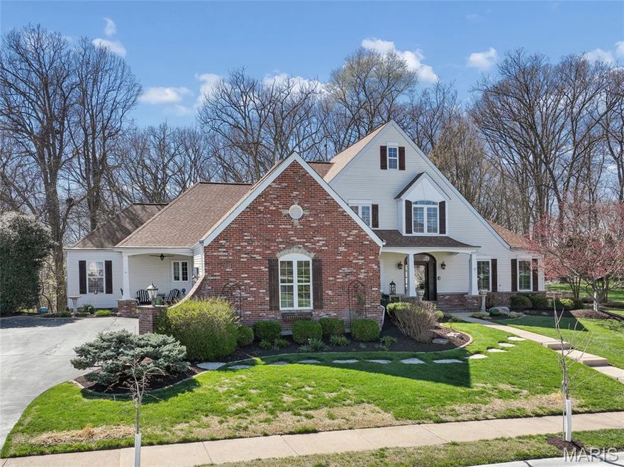 Welcome home to this Flower-built residence that effortlessly blends timeless design with everyday comfort. This beautifully crafted 1.5-story home captivates from the moment you arrive, with striking curb appeal, classic brick accents, and inviting front and side porches that set the tone for what lies within. Step through the front door into a light-filled foyer and discover a space designed to both impress and welcome. Rich wood flooring flows throughout the main level, leading into a breathtaking two-story great room anchored by a wall of windows that fills the home with natural light. Thoughtful details - plantation shutters, custom wood valances with roller shades, and built-in sound - create an atmosphere that is both refined and effortlessly livable. At the heart of the home, the chef’s kitchen inspires with quartz countertops, a spacious island with a 5-burner cooktop, double ovens, a walk-in pantry, and updated lighting - perfect for everything from quiet mornings to lively gatherings. Just off the kitchen, a warm and inviting hearth room offers the perfect place to relax, unwind, or gather - adding an extra layer of comfort and charm to the home’s central living space. The main-level primary suite offers a private retreat with a coffered ceiling and a beautifully updated, spa-like bath. Two additional bedrooms are tucked away and connected by an updated Jack-and-Jill bath, offering both comfort and functionality. A main-level laundry room adds everyday convenience. Step outside to a low-maintenance composite deck with a dry-below system and built-in gas line - ideal for effortless outdoor entertaining. The walk-out lower level, complete with zoned heating and cooling, provides endless possibilities for additional living or recreation space. Freshly painted and enhanced with an irrigation system, dual gas fireplaces, and a thoughtful collection of upgrades, this home is more than a place to live - it’s a place to truly feel at home. Make it your haven today.