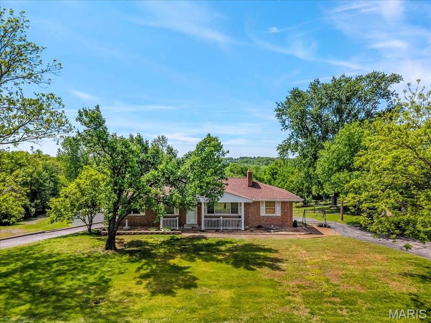 This is your chance to own 3.52 Acres with no HOA!  Ranch home at 2948 Erb Road sits on over 3 acres of lovely land with oversized 4 car rear entry garage with circular driveway and MASSIVE metal outbuilding of 120x60 which offers over 7200 sq ft of storage, work shop, perfect for car/motorcycle enthusiast, business owner, etc.  There is also an added on stable area of approx. 800 sq ft.  Potential to be a horse property as well.  Outbuilding has it's own electrical box, concrete floors, lots of metal shelving and 2 HUGE doors for entry.  The ranch home offers 2+ beds, 3 baths and over 2100 sq ft of living space.  Step inside from the covered front porch to the living room which offers solid wood floors, wood burning fireplace and lots of natural light and is open to the breakfast room which also has lots of natural light and wood floors.  Kitchen has SS appliances, custom cabinets and lots of counter space.  Off of the other end of the kitchen is an additional dining/family room area with tiled floors and side entry from the driveway.  Main floor also features primary bed with ensuite, 2nd bedroom and full hall bath.  Solid wood floors, neutral painting on main as well.  Finished lower level offers additional living space with LARGE rec area, wet bar and half bath along with 3rd bedroom/guest/office area which has walk-in closet, new carpet and paint.  Spacious washer/dryer area w/storage has door to OVERSIZED 4 car garage with additional storage area too!  Metal outbuilding offers so many possibilities as well!  Property is semi cleared and wooded acreage offers privacy and bow hunting opportunity on YOUR OWN LAND in St. Louis County!  High-end custom homes surround the property which make this truly desired.  Very convenient location with great access to shopping, medical, schools, parks, restaurants, major roads/highways.  Excellent Investment & Opportunity Awaits!