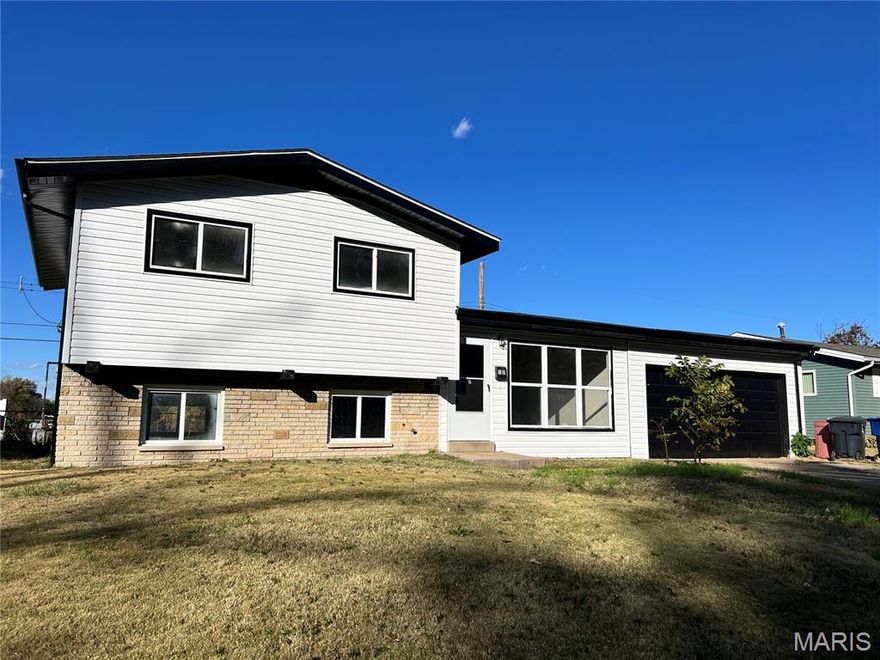 This 4-bedroom, 2-bathroom multi-level home has approx. 1483 sq ft of finished area on 3 levels and features a 2-car garage. Home has been totally remodeled-new roof, new furnace and AC, new vinyl siding, new gutters, new overhead garage door, fresh paint throughout, new deluxe LVT flooring, many new lights, fans, and doors, remodeled kitchen including new custom cabinets with granite countertop, new deluxe faucet, undermount sink, and custom backsplash and new stainless stove/oven, dishwasher and microwave, remodeled bathrooms including new custom tile tub surround in 2nd floor bathroom, and much more!