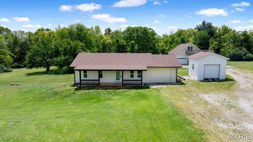 Privacy meets proximity! This stunning 2-bed, 1.5-bath home sits on 3.75 acres in Warren County, offering a secluded feel just minutes from city conveniences. Step inside to find a completely refreshed interior featuring brand-new LVP flooring throughout, a crisp modern paint palette, new water heater and new electric panel with 220 outlet in bonus room/was tanning bed room. Bathroom tub was just refinished.  Kitchen offers tons of space featuring newly painted cabinets and dining space just off of the back deck with a view of privacy! Perfect for those seeking low-maintenance living with plenty of room to roam. Property also features a 14x14 insulated detached garage along with a 30x28 insulated detached garage with partial concrete floor, electric, and hvac with finished loft space.  Roofs on all structures are only 5 years old.  Brand new exterior paint on the home and front porch.