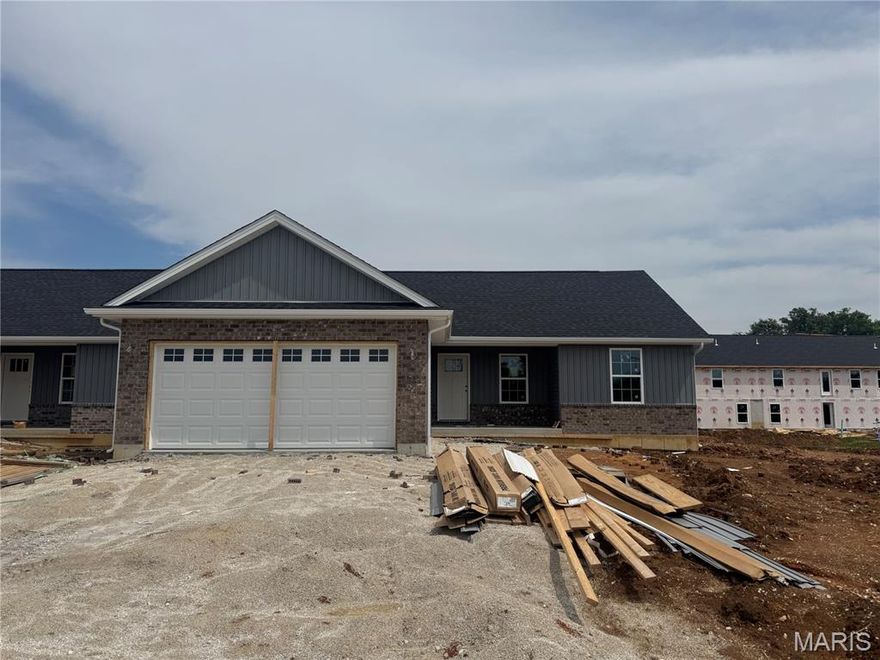Move in early this summer. Welcome to Grindstone Grove in Moscow Mills. Beautiful new ranch villa/duplex located on lot 10A has all the bells and whistles. Each home is designed for personal privacy, loaded with high quality finishes, and built by one of the best custom builders in the area. Your next home is 1216 sq ft, 3 bedroom, 2 bathroom, oversized two car garage, full basement and a large backyard. The custom type finishes include granite countertops, stainless steel appliances, luxury vinyl plank flooring in main living area, spindled staircase railing, vaulted living room and kitchen, large center island, ceiling fans in all bedrooms and living room, can style lights, brush nickel finishes including shower door in master, and much more. Grindstone Grove is just off quiet Railroad Street with high speed Gateway Fiber internet, no monthly HOA fee, new concrete streets, street lights, and will have sidewalks throughout for homeowner safety. USDA, VA, & FHA eligible. Agent owned. All finished pictures are of previously built home. Cabinet color may be stained brown or white. Estimated completion late June early July.
