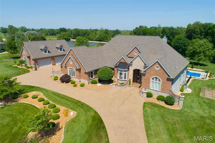 Stunning Executive Style Ranch Home with over 7400 sq ft of Living Space, 5 Beds/5 Updated Bath, 2 Fireplaces, 2 Kitchens, Full Finished Lower Level, 6+ Car Garage with Finished Loft, the Perfect Outdoor Living Space with a Large Pool, Hot Tub, Composite Deck and Much More! You will be Instantly Impressed as you pull up to this home with 4.5 Acres of Beautifully Manicured Grounds. The Circular Aggregate Driveway leading to your Custom Built Home! Welcome Friends into the Large Foyer with 12 Ft Ceiling, Columns, Wood Flooring, Open Floor Plan and Lots of Natural Light! The Main Floor Gourmet Kitchen is Unmatched with Custom Cabinets, Granite, Large Center Island, Walk-in Pantry, Breakfast Room along with the Hearth Rm! This is a Split Ranch so the Master Suite is Large with a sitting rm, 2 Primary Closet & Luxury Bath with Separate Tub/Shower and Adult Height Vanities. The other 2 Bedrooms are also Generously Sized! The Finished Walkout Basement is Spectacular with Rec Rm, Full Kitchen, Custom Bar, 2 additional Bedrooms and 2 bath, don't miss the Current Craft Room/Gym Area! Walkout the French Doors to your Resort Style Large Patio & Pool Area for Large Parties or Just Family, Perfect! The Separate 4 Car Garage is oversized with a Finished Loft for Man Cave or additional Storage! Notice the extensive Private Lot! This is a MUST SEE Opportunity, Don't Miss this Home!