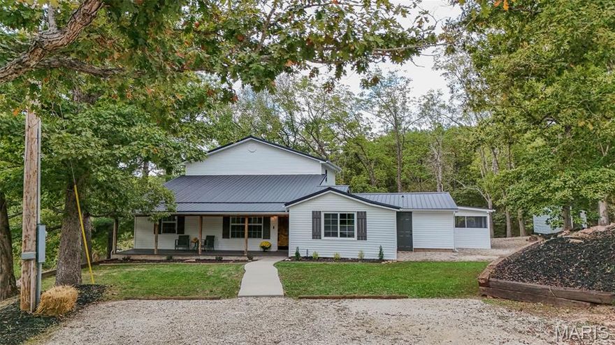 HILLTOP RETREAT WITH ACREAGE, UPGRADES & VERSATILE WORKSHOP
Nestled on nearly an acre in a private, hilltop setting, this beautifully reimagined 4-bedroom, 2.5-bath home offers the perfect blend of modern comfort and timeless charm. Spacious interiors and inviting porches encourage seamless indoor-outdoor living, while a long list of premium upgrades ensures move-in-ready convenience.
Enjoy peace of mind with a brand-new metal roof and low-maintenance exterior. Inside, discover upgraded flooring throughout, a fully renovated kitchen with new appliances, and refreshed bathrooms that reflect contemporary style and function.  Beyond the main home, a fully finished, climate-controlled workshop provides endless possibilities—ideal for a home business, art studio, or easy conversion into a guest house. A large yard, extra storage shed, and tranquil surroundings add to the retreat-like feel of this exceptional property.  Conveniently located between Rolla, MO and Fort Leonard Wood, this home offers easy access to local amenities, employment centers, and services—while remaining a peaceful escape from the everyday hustle.  Just steps from the Mark Twain National Forest and minutes from the Little Piney River, you’ll enjoy unmatched opportunities for hiking, fishing, and outdoor adventure.  Make an appointment today to view this rare opportunity to own a thoughtfully updated home that blends luxury, versatility, and the natural beauty of Missouri.