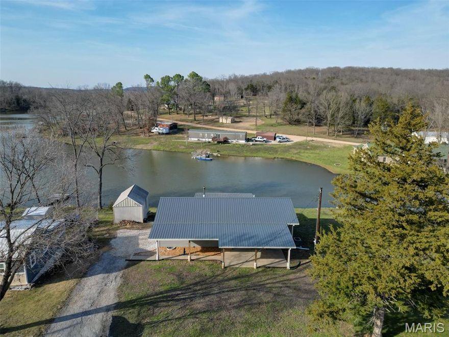 Exceptional new home on the water at Brown Shanty, just a short drive from Hermann, MO! Come and see your new weekend getaway or make it your permanent residence!  No Drywall anywhere!  Beautiful wood is all around!  Warm and inviting and move-in ready, this home welcomes you in and you won't want to leave! Enjoy the views of the lake from the covered deck!  Fish in the lake or get on the Gasconade River at the access just down the road! This place is perfect for anyone wanting peace and serenity on the water! Construction was completed in July, and this place is ready to go! There is a little storage shed for your tools and toys, and inside you will find 3 bedrooms and 1.5 baths, a water softener, and a brand-new washer and dryer set! Stainless appliances grace the kitchen and compliment the granite countertops. A wood stove in the living area will warm the entire home on those cool Fall evenings or those cold Winter nights!  Truly a one of kind retreat! Come and see this remarkable home on the lake and start enjoying all it has to offer... fishing on the lake and floating or kayaking on the Gasconade... this place will make memories for you and yours for years to come! NO FLOODPLAIN! Awesome!