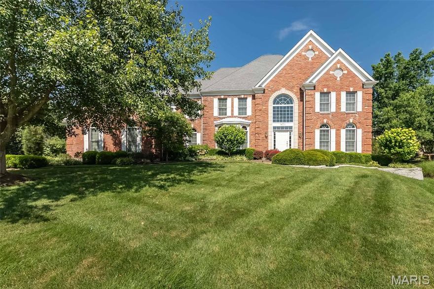 Meticulously maintained brick 2 Sty in prestigious Brook Hill Estates. Custom amenities & distinctive design elements including oak hardwoods, detailed trim work & palladian windows are featured throughout the home. Impressive 2-sty foyer leads to formal living room with French doors & custom built-in bookcases, elegant dining room perfect for entertaining & spacious family room with wide bay window, wet bar, brick fireplace and custom built in's. Chef’s kitchen with 42” white cabinetry, granite countertops, premium appliances, center island & butler’s pantry adjoins light-filled breakfast room with convenient planning center & vaulted hearth room with fireplace. T-staircase accesses coffered primary bedroom suite with luxury bath with jetted tub and double vanities plus 3 additional bedrooms, 1 with ensuite bath & 2 with Jack n’ Jill bath. Lower Level includes fantastic living space w/ large recreation room with wet bar & 3rd fireplace, office, workout room & .5 bath. Situated on a .5-ac cul-de-sac lot with paver patio surrounded by landscaped gardens & 3-car garage.  Conveniently located with easy access to Hwy 40, top rated schools, and shopping.