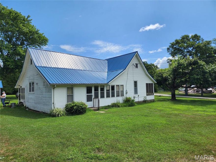This home has 1180 SF of heated and cooled living space with another 485 SF under roof.  There are two bedrooms, one bath, kitchen with walk-in pantry, dining room, living room, laundry room, sun room, and screened-in front porch.  The vinyl siding and metal roof make the exterior virtually maintenance free.  The carport provides covered parking and the workshop building offers plenty of space for projects and storage.  This sits on 8 lots for a total of 1.62 acres, m/l which is very well maintained and has some beautiful, mature shade trees.  Clearwater and Wappapello Lakes, Black and St. Francis Rivers, Sam A Baker State Park, Piedmont, MO and 1000's of acres of National Forests are all nearby.  Van Buren and the Current River are just about 25 minutes away.  Schedule your appointment to view this property today.