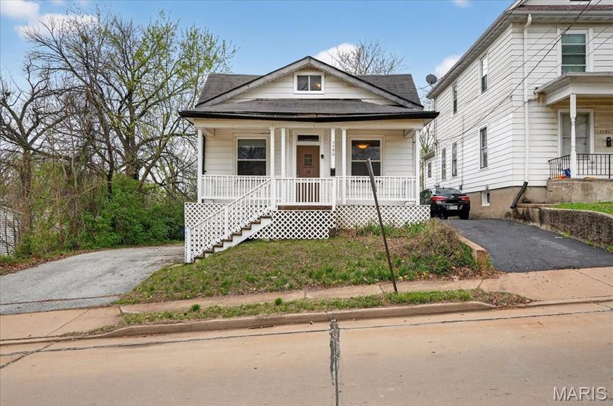 TO BE SOLD AS IS. SELLER WILL NOT MAKE ANY REPAIRS OR PROVIDE ANY INSPECTIONS. Just minutes from downtown Maplewood or Hwy 40 this vinyl sided 1.5 story comes with 2 brs, a bath with some updates, main floor laundry and an expanded attic which might make a children play area, a quiet time space or additional storage. There are wood floors in the living room, kitchen and 2nd bedroom, double pane tilt windows, panel doors and 9' ceilings. Stainless steel appliances in the kitchen with subway tile back splash. The front porch is big enough to while away some time. Big spacious back yard and a drive way big enough for 4 vehicles. Electric panel box was updated in 2014 and the water heater in 2013.