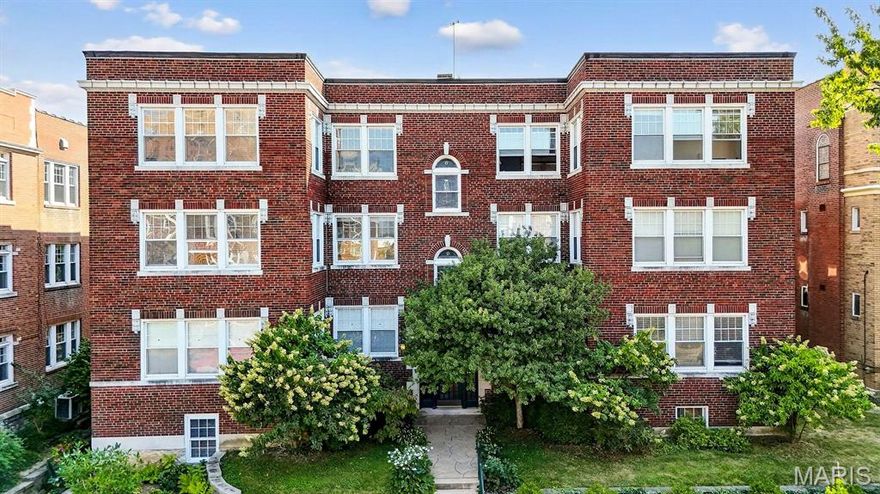 Perched atop a historic building in the heart of Hi-Pointe–DeMun, this top-floor condominium is a rare blend of character, light, and location—offerings like this are seldom available. Perfectly positioned between Forest Park and Concordia Park, the residence enjoys treetop views, exceptional walkability, and the timeless appeal of one of St. Louis’ most valuable and sought-after neighborhoods.

Inside, an airy open floorplan seamlessly connects the kitchen, dining, and living spaces, framed by oversized windows that flood the home with natural light and create a true treehouse feel. Original architectural details pair beautifully with thoughtful updates, delivering classic elegance with modern comfort.

A private deck tucked above the tree line adds an unexpected sense of serenity rarely found this close to everything.

Dedicated parking, ample storage, and a well-managed HOA provide ease of living—features increasingly difficult to find in historic condominiums. Step outside to the Village of DeMun’s celebrated restaurants, cafes, and boutiques, or enjoy immediate access to Forest Park’s golf, tennis, trails, and world-class cultural institutions. Washington University, Barnes-Jewish and Children’s Hospitals, and the Metrolink are all moments away.

With top-floor units in Hi-Pointe–DeMun rarely coming to market, this is a limited opportunity to secure a truly special home in an irreplaceable location.