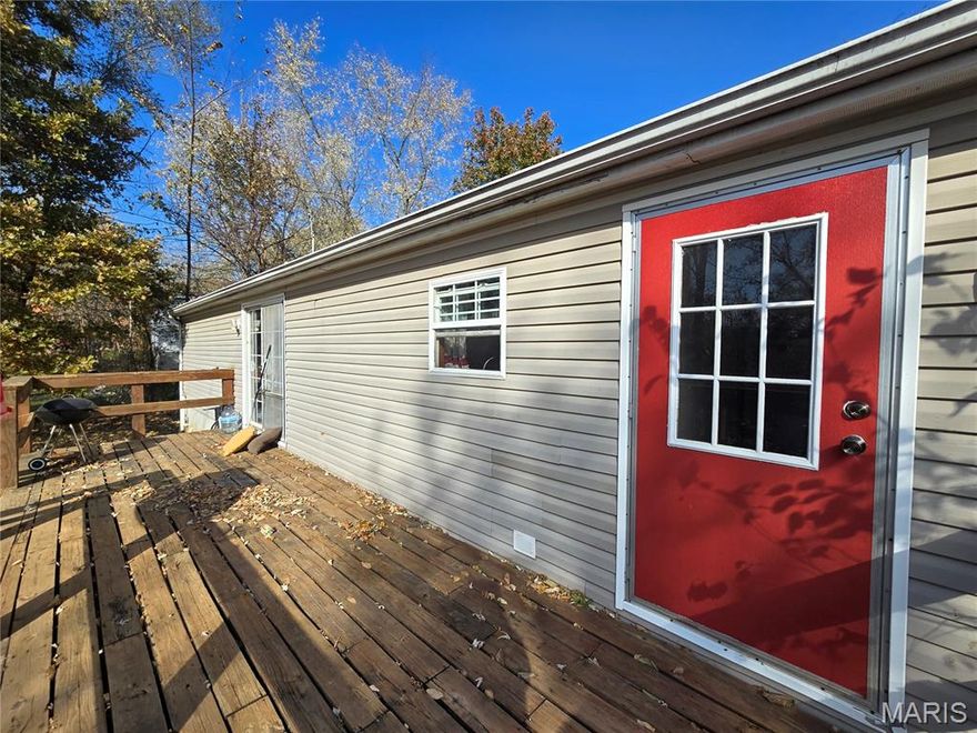 This spacious 3 bed, 2 bath manufactured home on a basement offers an incredible opportunity for homeowners or investors looking for functionality and value. There is fencing on all sides but the driveway for added privacy and convenience. Newer roof, septic and hot water heater. There is a large deck perfect for entertaining or relaxing. The walk-out basement is ready for storage, a workshop or possible future living space. Add your personal touches and build your equity as you go, through renovations and creating your dream home on a budget! Whether you are a DIYer, investor or buyer looking for space and potential, this location is a rare find in the Ste. Genevieve area. Easy access to Highway 32, B and 55, close to golf clubs, wineries, restaurants and more!