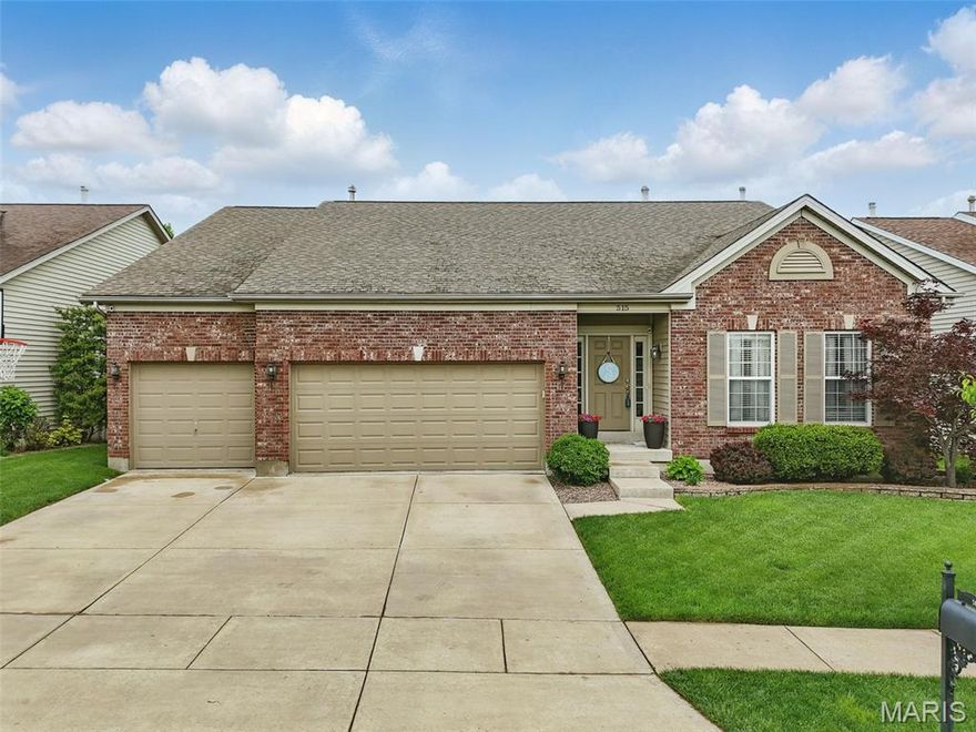 This IMMACULATE ranch w/tall 9' ceilings & rich hardwood floors on the main level is filled with luxurious finishes you will love. Updated kitchen has quartz counters, 42" soft-close cabinets w/roll-out trays, stainless steel appliances, breakfast bar & breakfast room w/bay sliding door that opens to a composite deck. Gather in the great room w/fireplace flanked by plantation shutter-covered windows & a shiplap wall. Dining room has beautiful board & batten wall accents. Tucked in the back is a private primary suite w/walk-in closet & lovely ensuite bath. Entertain in the spacious lower level rec room w/wet bar that opens to the covered patio in the irrigated yard w/invisible pet fence. Lower level also has a home office & private bedroom & full bath teens/guests will appreciate. 3-car garage. Neighborhood pool & playground down the street.  All 3 Wentzville (Liberty) Schools are nearby, as well as great shopping, dining & weekend farmer's market. Easy access to I-64/364. See it today!